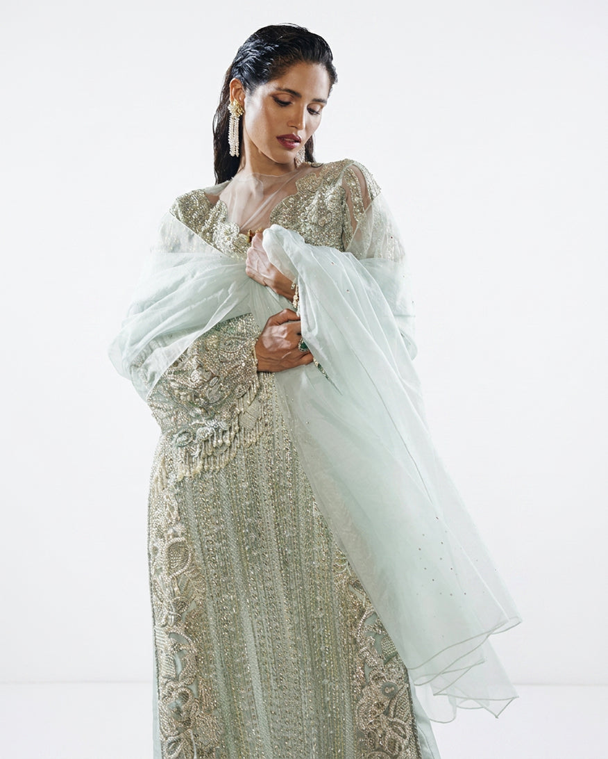 Close-up portrait in an Aqua Net suit with a diaphanous organza dupatta