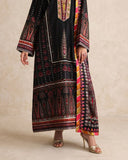 Close-up of embroidered hem border and striped dupatta on black printed raw silk suit