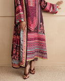 Close-up of embroidered hem lace and striped trouser on deep purple printed raw silk suit