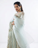Close-up portrait in an Aqua Net suit with an embellished organza dupatta wrapped close
