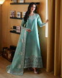 Woman wearing a mint green luxury pret suit with silver embroidery, Zarminay collection