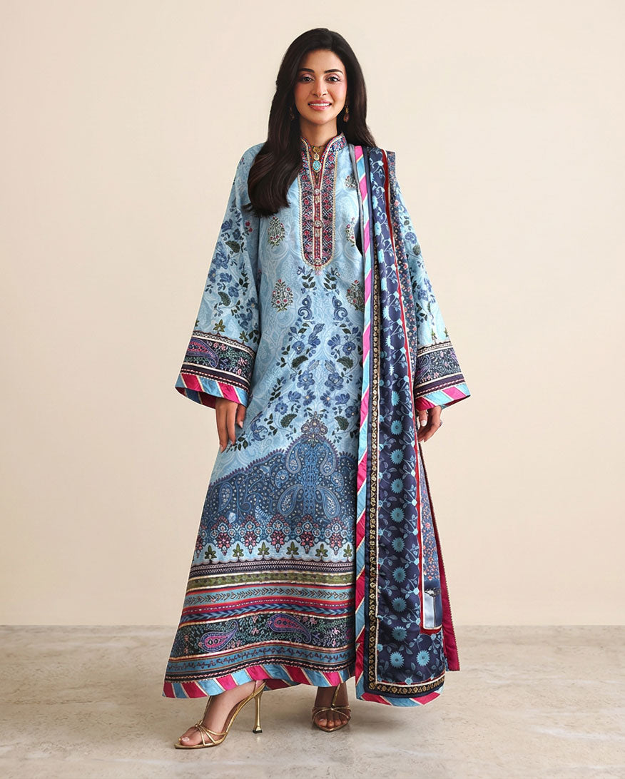 Woman wearing blue printed raw silk suit with pink dupatta border