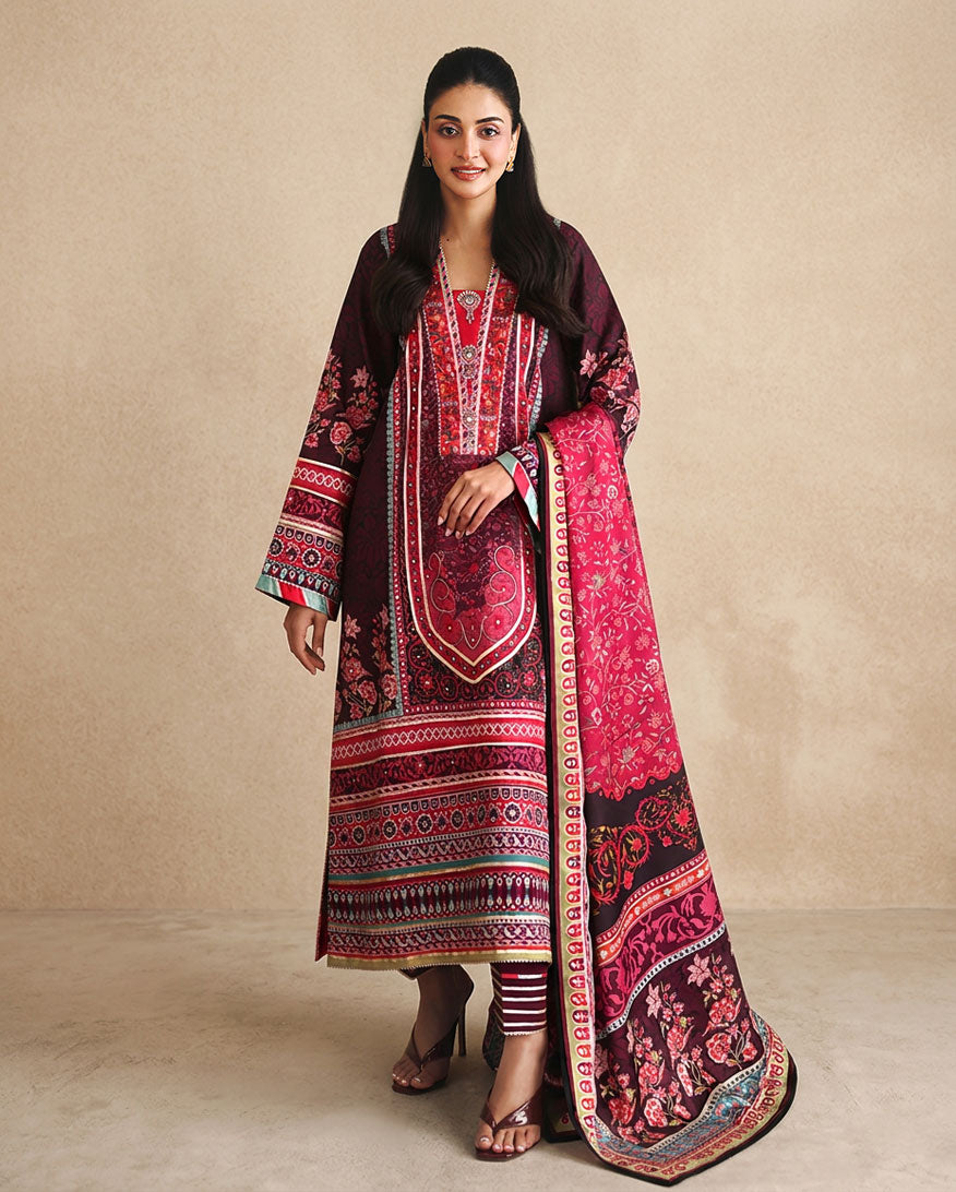 Woman wearing deep purple printed raw silk suit with pink embroidered dupatta border