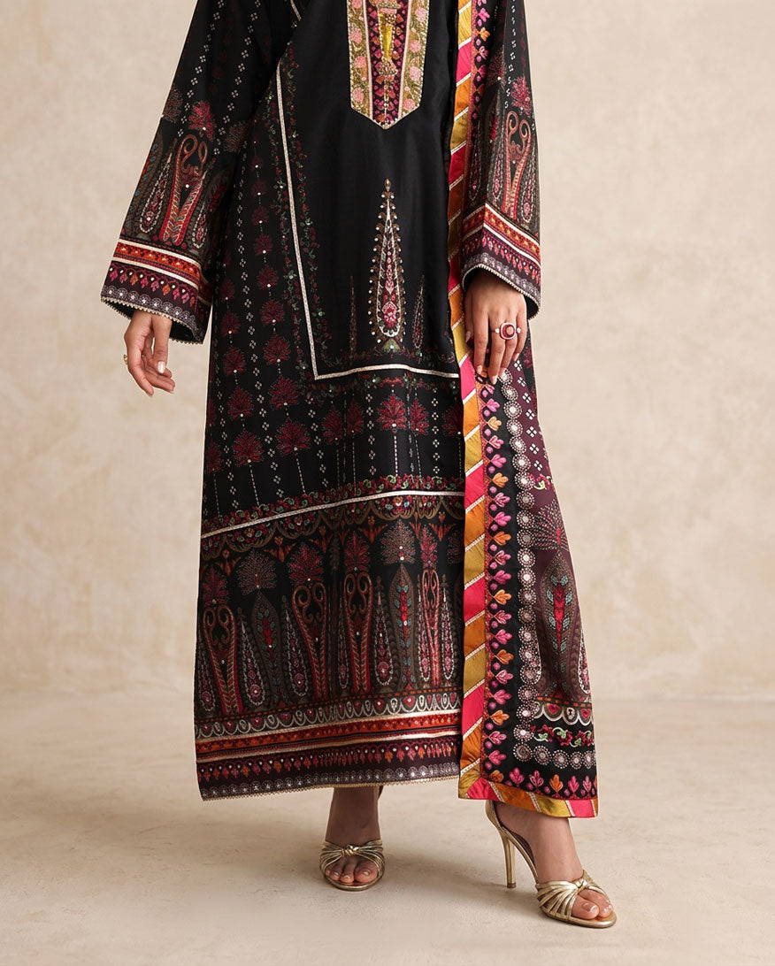 Close-up of embroidered hem border and striped dupatta on black printed raw silk suit