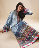 Woman wearing blue printed raw silk suit seated on the floor with dupatta spread out