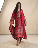 Woman wearing red printed raw silk suit walking with dupatta flowing