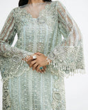 Close-up of intricate embroidery on the sleeve and bodice of an Aqua Net suit