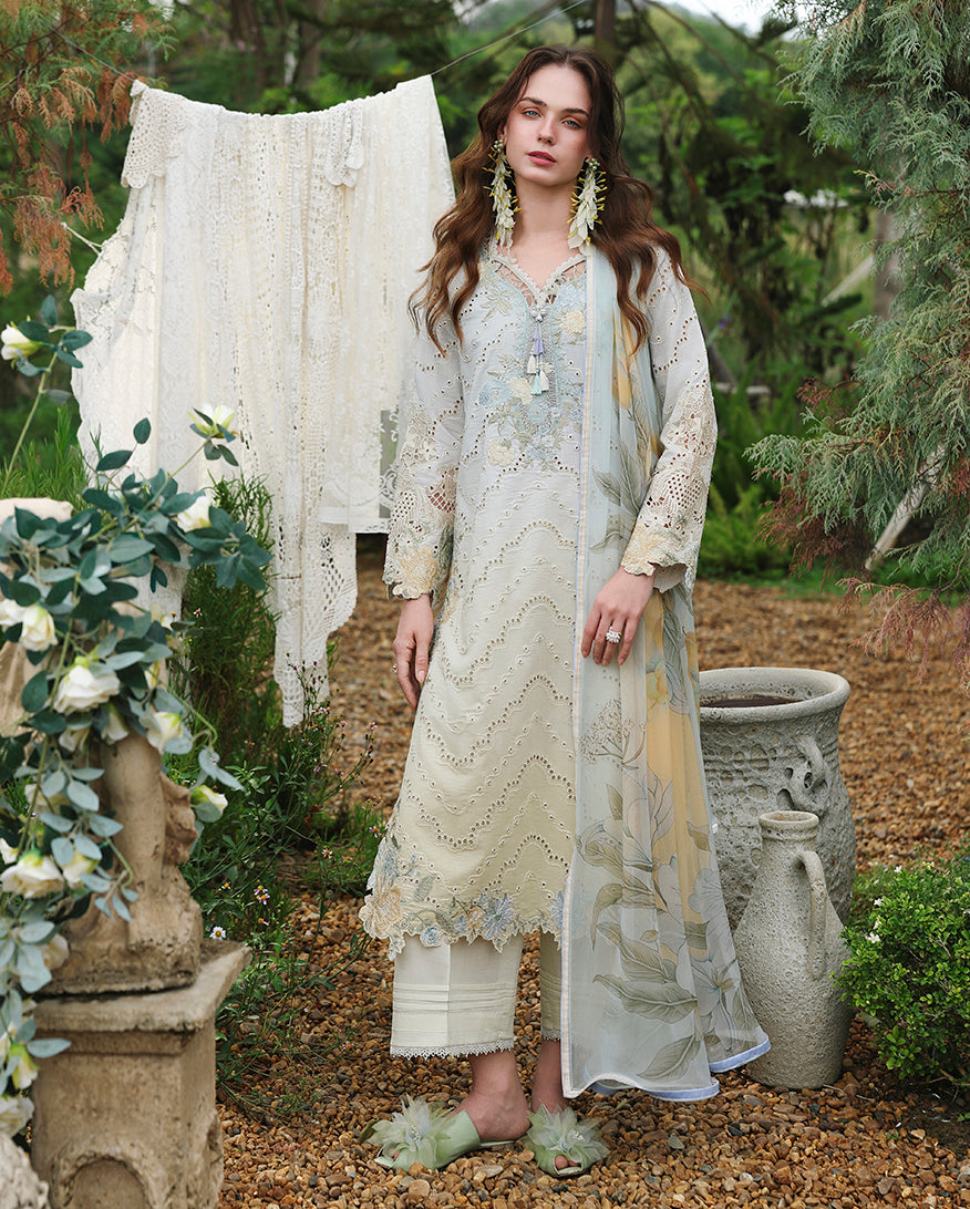 Woman wearing lemon yellow embroidered lawn suit with lace detailing and printed dupatta, Secret Garden collection