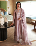 Woman wearing a dusty mauve luxury pret suit with silver embroidery, Zarminay collection