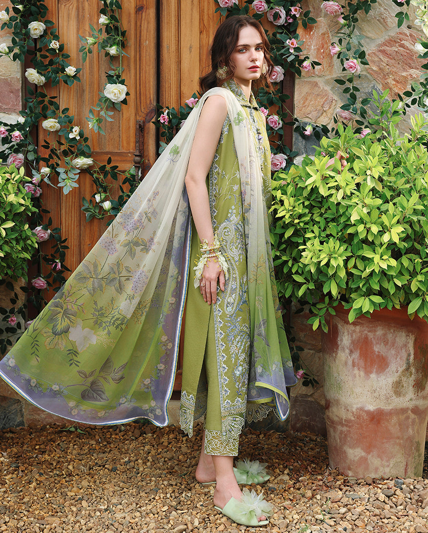 Side view of olive green embroidered lawn unstitched suit with printed dupatta flowing, Secret Garden collection
