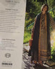 Mushq Broadway Winter Vol. I showing the Gilded Arch winter unstitched beige jacquard fabric pieces: striped fabric, gold embroidered borders, shell tassels, plain navy fabric and embroidered motifs