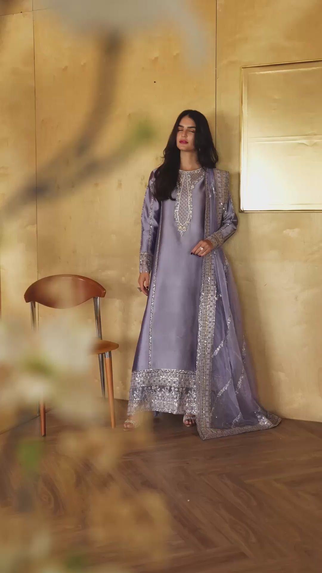 Woman wearing a lavender embellished kurta with sequin-embroidered neckline panel and matching border, styled against a golden-paneled interior, Zarminay | Luxury Pret collection